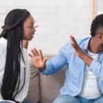 A ₦3 Million Gift Gone Wrong: Man Rejected His Wife Money Because Of The Transaction Narration His Wife Used "Contribution For The House Project” relationship-problems-black-millennial-couple-arguing-sofa-home-panorama-free-space-black-millennial-couple-arguing-166945396