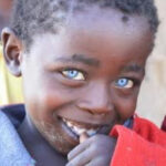 Shocking: See the Strange Nigeria Village Where Almost Everyone Has Blue Eyes Despite Having No Foreign Ancestors (Photos) boy with sapphire eyes 2